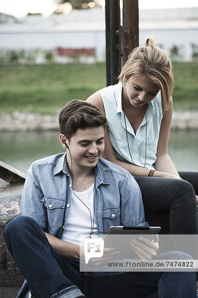 Couple using Tablet PC  Mannheim  Baden-Wurttemberg  Germany