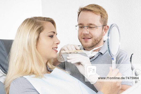 Young Woman and Dentist at Dentist's Office for Appointment  Germany