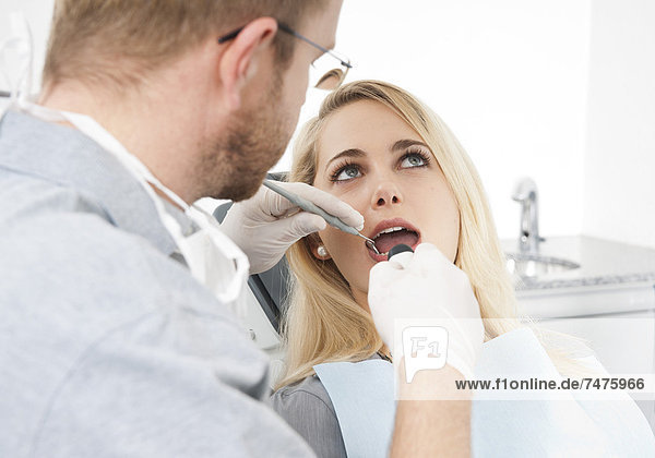 Young Woman and Dentist at Dentist's Office for Appointment  Germany