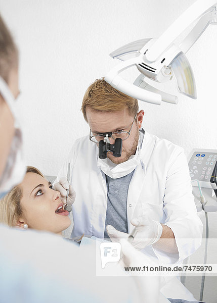 Young Woman getting Check-up at Dentist's Office  Germany