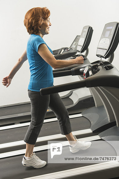 Senior woman on treadmill