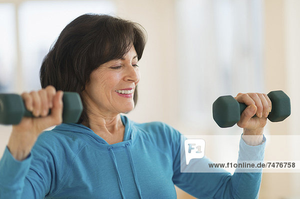 Portrait of senior woman exercising