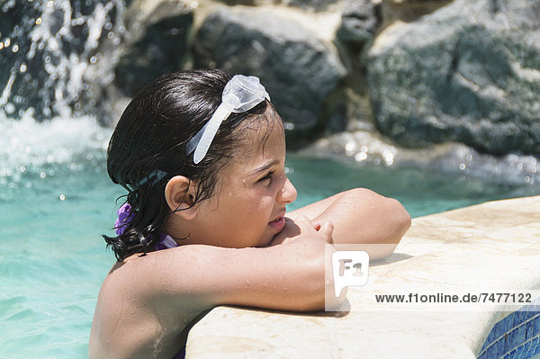 View of girl (8-9 years) wearing swimming goggle