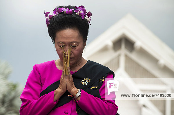 Traditional dance woman wearing traditional clothing making a gesture of greeting or Wai Loi Krathong or Loy Gratong Festival Chiang Mai Northern Thailand Thailand Asia