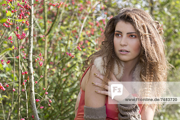 Portrait of a young woman outdoors in autumn