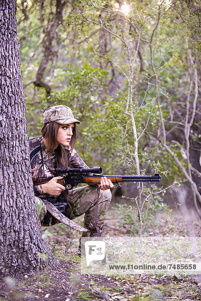 USA  Texas  Young woman with Lever Action Hunting Rifle