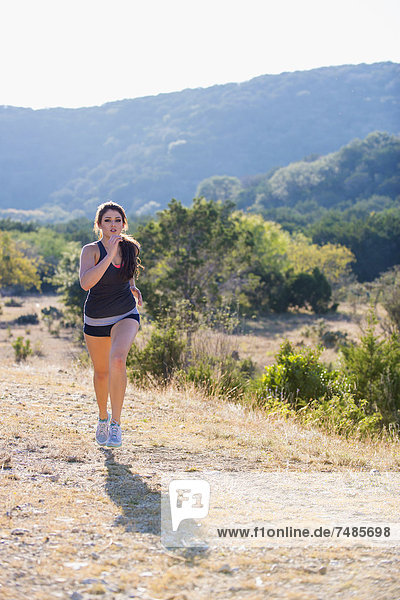 USA  Texas  Young woman jogging