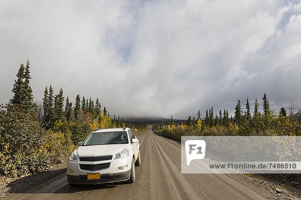 USA  Alaska  Car moving through Denali Highway in autumn
