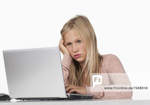 Teenage girl using laptop  close up