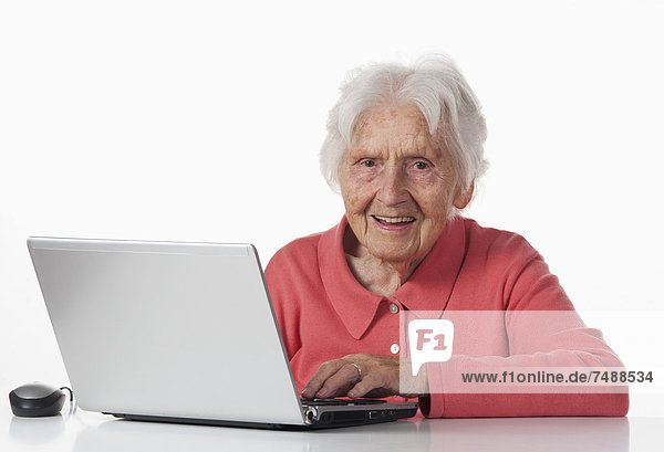 Senior woman using laptop  close up