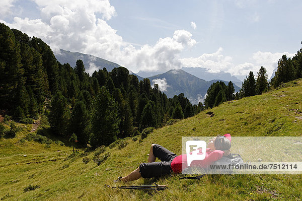 Hiker at the Raschötz or Rasciesa mountain pasture  near St. Ulrich  Val Gardena valley  Southern Tyrol  Alto Adige  Italy  Europe