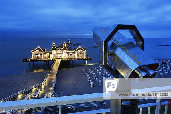 Illuminated pier  telescope  Baltic Sea resort of Sellin