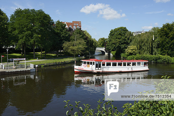 Steamer on the course of the Alster river at the towpath  pier  Streekbruecke bridge