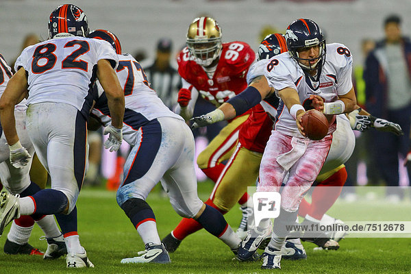 QB Kyle Orton  #08 Broncos  hands off the ball during the NFL International game between the San Francisco 49ers and the Denver Broncos on October 31  2010 in London  England  United Kingdom  Europe