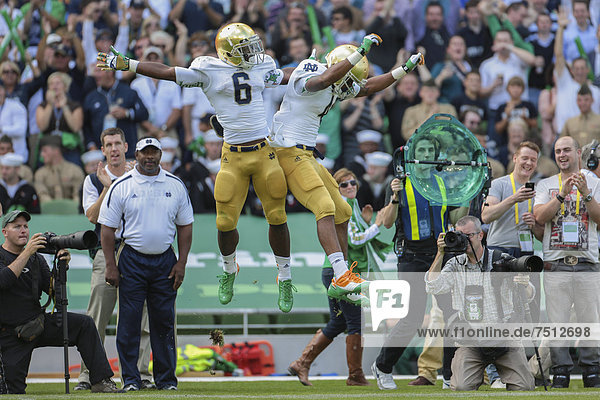 RB George Atkinson  #4 Notre Dame  and RB Theo Riddick  #6 Notre Dame  celebrate a touchdown during the NCAA football game between the Navy and the Notre Dame on September 1  2012 in Dublin  Ireland  Europe