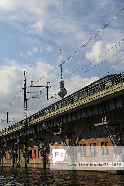 Television tower at Alexanderplatz square  viewed across the Spree river  railway lines at front  Berlin  Germany  Europe