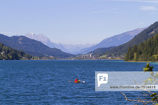 Looking west over the deep blue waters of Weissensee lake  Carinthia  Austria  Europe