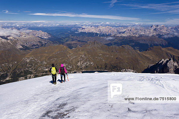 Mountain climbers on Marmolada Mountain  Dolomites  Italy  Europe