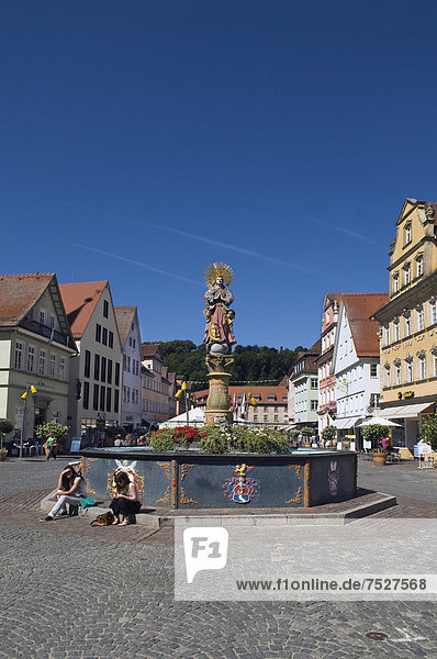 Marienbrunnen fountain with column from the Renaissance  crowned by a double image of the Madonna in a steel ring  dated 1686  Schwaebisch Gmuend  Baden-Wuerttemberg  Germany  Europe
