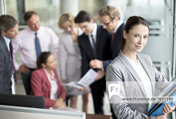 Business woman smiling in office