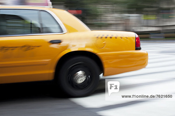 Blurred view of taxi on city street