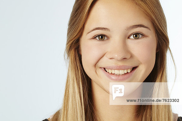 Close up of teenage girls smiling face