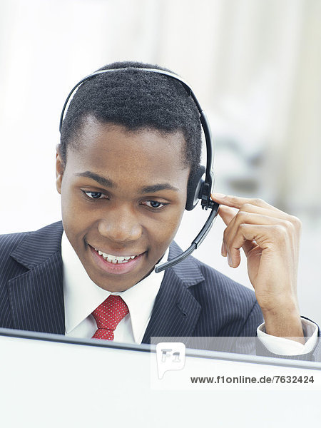 Businessman  wearing a headset in an office