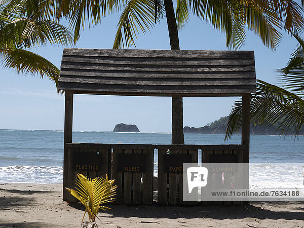 Wooden hut that serves as a waste separation station for plastic  paper and aluminium  Playa Carryllo  Nicoya Peninsula  Costa Rica  Central America