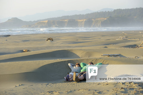 USA  United States  America  North America  Pacific Northwest  Oregon  Coast  dunes  wild  Pacific  ocean  beach  sand  man  woman  people  fun