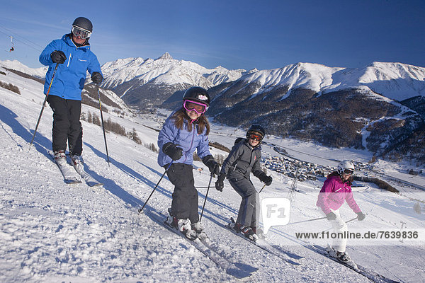 Family  skiing  winter sports  Zuoz  family  ski  skiing  winter sports  Carving  winter  winter sports  canton  GR  Graubünden  Grisons  Engadin  Engadine  Oberengadin  Switzerland  Europe