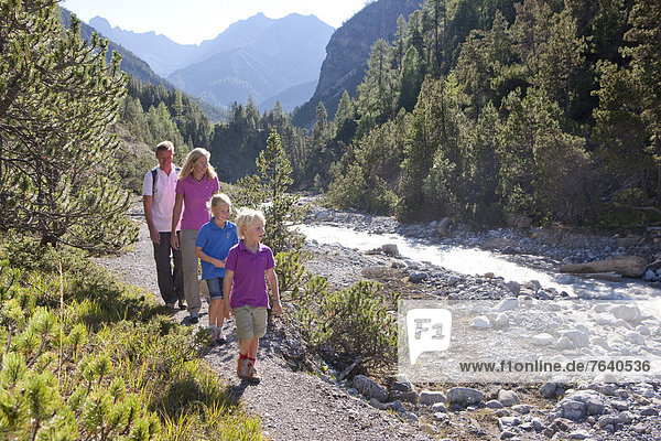 Family  walking  hiking  national park  Ofenpass  nature  Il Fuorn  wood  forest  canton  GR  Graubünden  Grisons  family  footpath  walking  hiking  trekking  Switzerland  Europe  brook