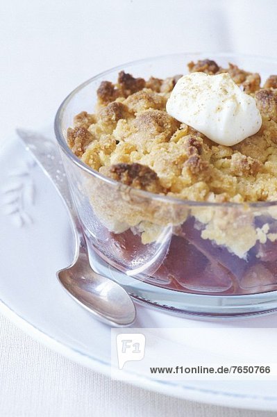 Peach crumble with creme fraiche and grated tonka beans