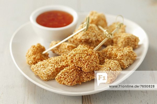 Chicken with a sesame crust and chilli sauce