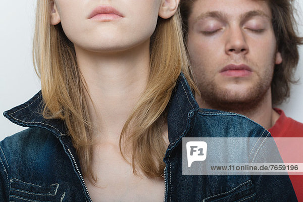 Young couple  man's eyes closed