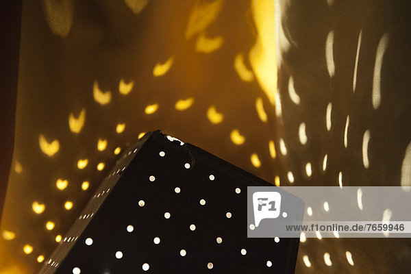 Pattern created by perforated lamp