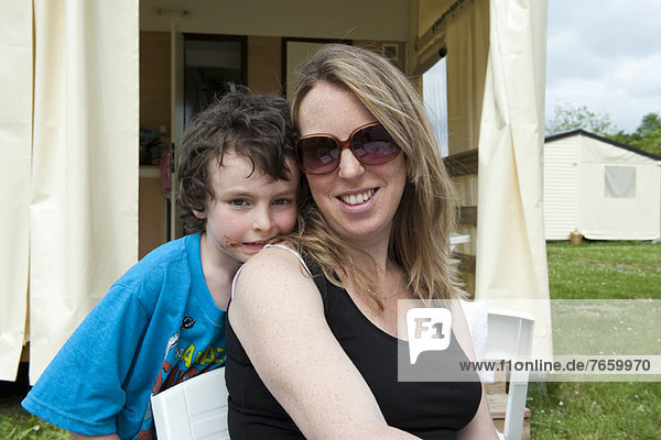 Mother and son together outdoors  portrait