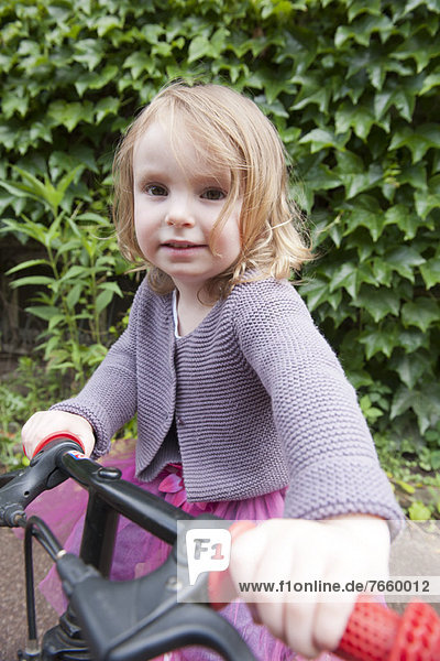 Little girl with bicycle  portrait