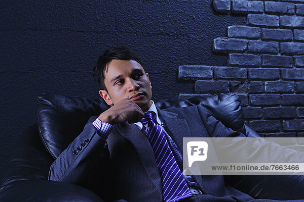 Businessman sitting on a sofa