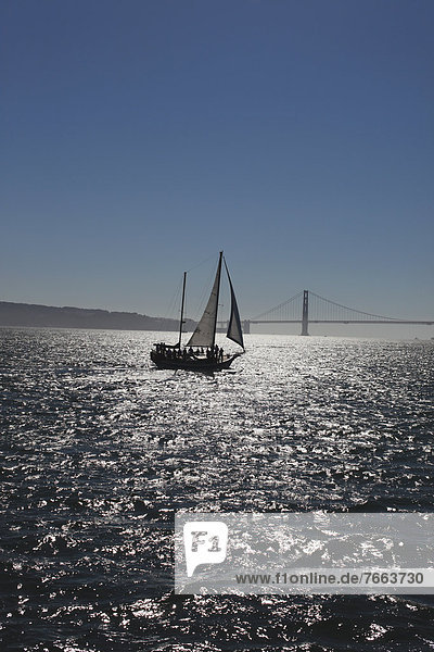 Boat sailing and Golden Gate Bridge