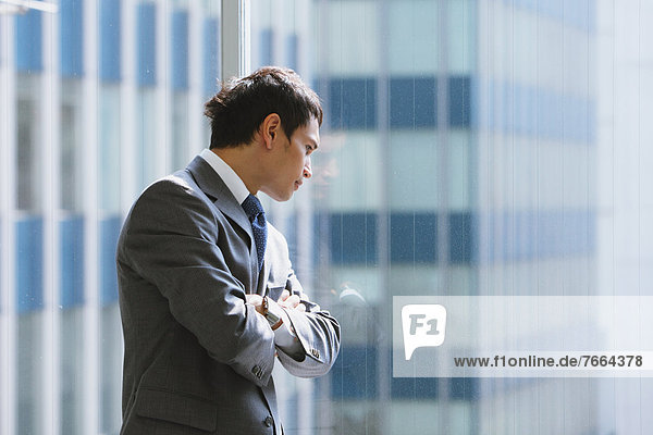 Businessman looking out of the window