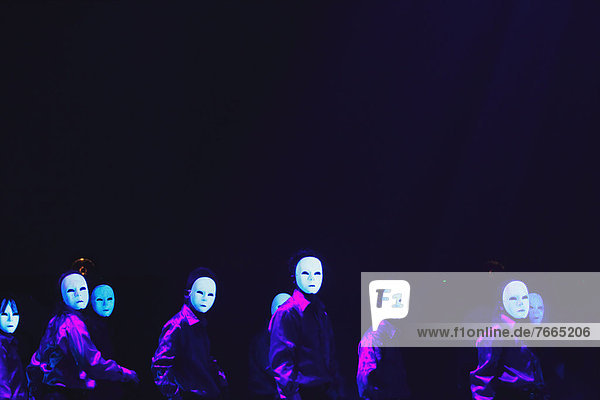 Group of dancers wearing masks