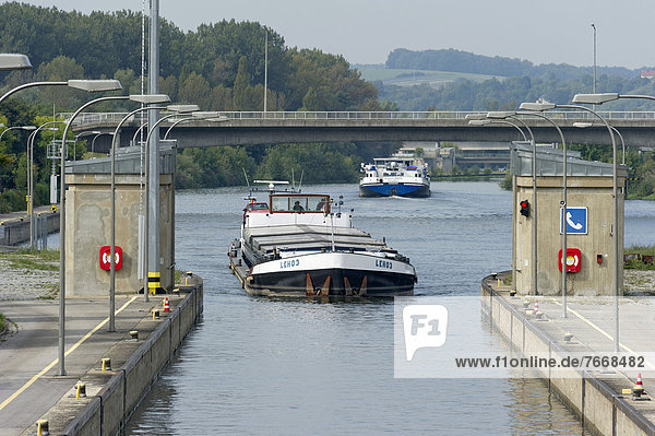 Cargo ship entering a lock  Rhine?Main?Danube Canal  Regensburg  Upper Palatinate  Bavaria  Germany  Europe