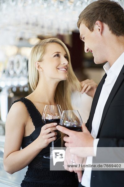 Couple drinking wine in restaurant