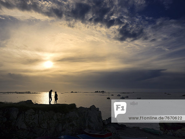 Young couple in silhouette on an Atlantic beach near Plouguerneau  Brittany  Finistere  France  Europe  PublicGround