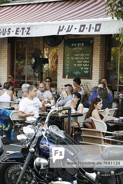 Young people sitting at Sus Etz Cafe in the trendy Sheinkin street  Tel Aviv  Israel  Middle East