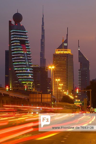 City skyline and car trail lights at sunset  Dubai  United Arab Emirates  Middle East