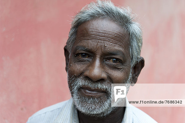 Portrait of an old Tamil man with a gray beard