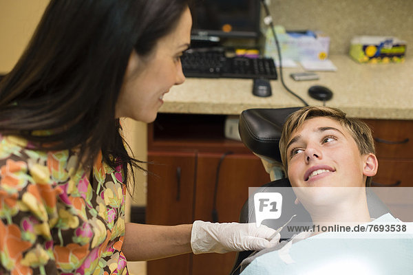 Nurse talking to dental patient
