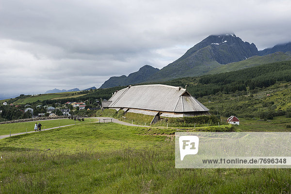 Lofotr Viking Museum  reconstructed longhouse  mountain landscape at back