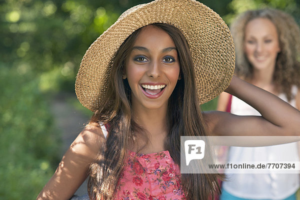 Teenage girl wearing straw hat